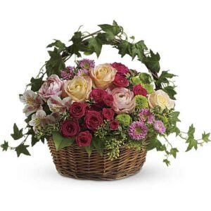 Fuchsia and pink flower basket with roses and ranunculus