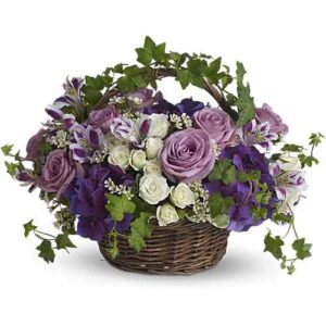 Funeral flower basket with purple and white flowers