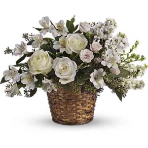 White and pink sympathy basket with roses in wicker