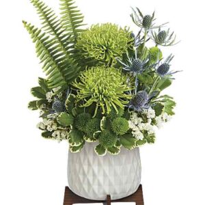 Green cymbidium orchid and chrysanthemum bouquet in ceramic planter